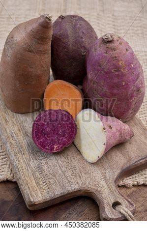 Colorful Root Vegetables Pink, Purple And Orange Organic Sweet Potatos