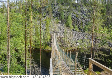 View To The Wooden Bridge Over The Canyon Lake Julma-olkky, Hossa National Park, Kuusamo, Finland