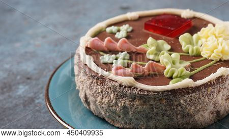 A Kyiv Cake On A Blue Plate. It's A Brand Of Dessert Cake Made In Kyiv, Ukraine. Kyiv Cake With Choc