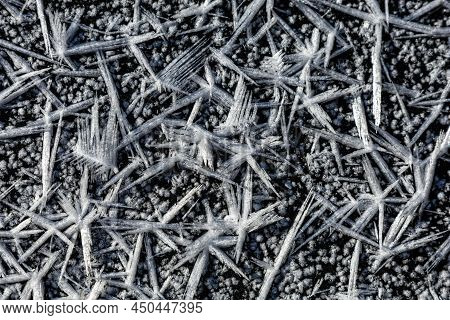 Ice Crystals Forming On Surface Of Frozen Pond