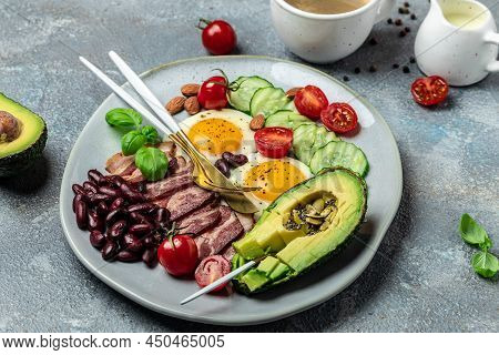 Keto Breakfast With Avocado, Fried Eggs, Bacon, And Beans. Paleo Keto Breakfast Diet Lunch. Healthy 