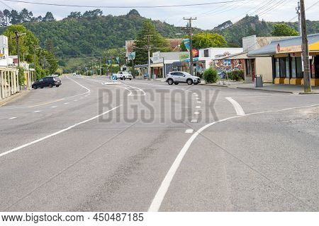 Tolaga Bay New Zealand - February 6 2022; State Highway 35 Passing And Parked Cars Buildings Through