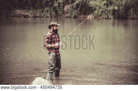 Male Fishing On The Lake. Relax In Natural Environment. Good Profit. Carry On Fishing. Man Relaxing 