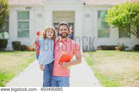 Father Supports And Motivates Son. Kid Going To Primary School. Father Walking To School With Child.