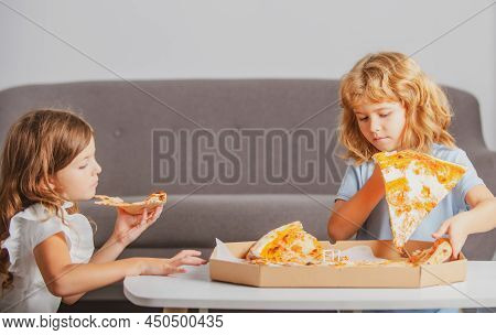 Pizza And Kids, Slices Pizza In Kids Hand. Children Eating Tasty Fast Food Pizza With Cheese. Little