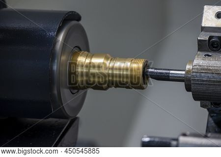 The  Cnc Lathe Machine Bore Cutting The Brass Pipe Connector Parts. The Hi-technology Metal Working 