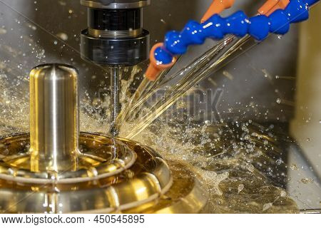 Close-up Scene The Cnc Milling Machine Cutting The Shell Mold Parts With Oil Coolant Method. The Mol