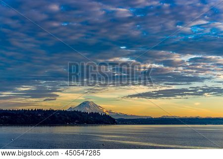 A View Ofr Mount Rainier From Burien, Washington At Sunset.
