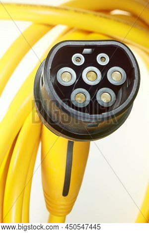 A Colored Charging Cable For Electric Cars Against A White Background.