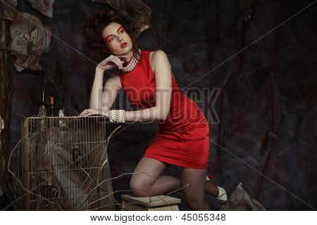elegant sensual young woman in red dress