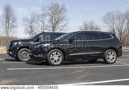 Kokomo - Circa March 2022: Gmc Yukon Denali And Buick Enclave Display At A Dealership. The Yukon And