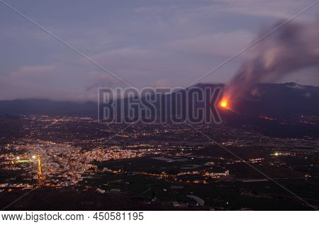 Volcanic Eruption Of Cumbre Vieja Next To The Village Of Los Llanos De Aridane At Sunset. La Palma. 