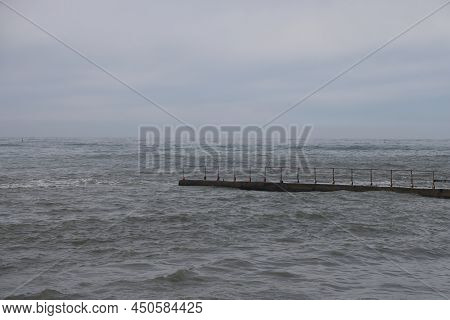 Sochi, Russia 05.07.2021. Breakwater Pier Summer Black Sea Cloudy.
