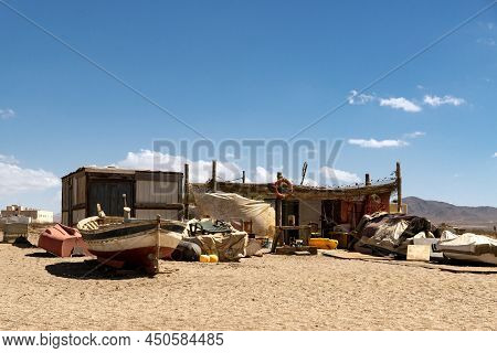 Cabo De Gata, Spain - September 04, 2020: Fishing Boats And Ships Stranded On The Beach Sand In The 