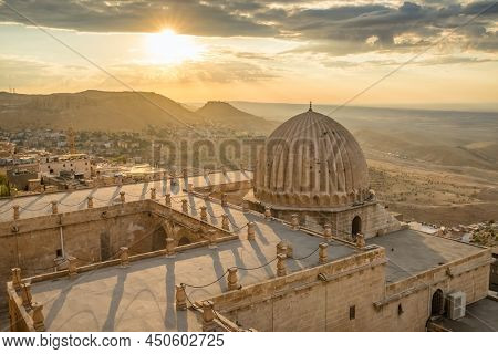 Zinciriye Medresesi or Sultan Isa Madrasa at sunset in Mardin, Turkey