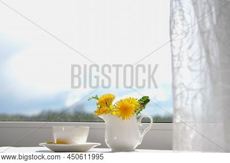 Cup Of Tea, Dandelion Flowers And Phone. Spring Morning.