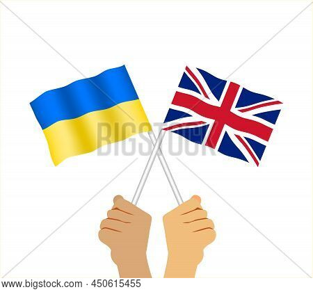 Hands Holding British And Ukrainian Flag. Two Waving State Flags Of Great Britain And Ukraine. Flat 