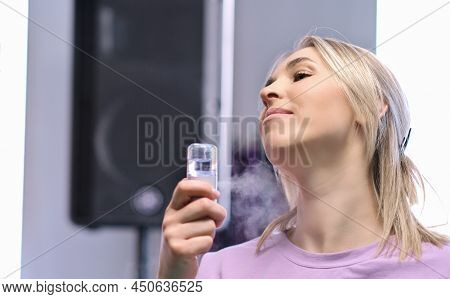 Woman Holding Portable Usb Mist Sprayer For Air Humudifying And Moisturizing Skin. Mini Humidifier F