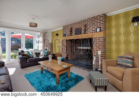 Bottisham, Cambridgeshire - June 4 2015: Modern Furnished Living Room With Feature Brick Fireplace, 