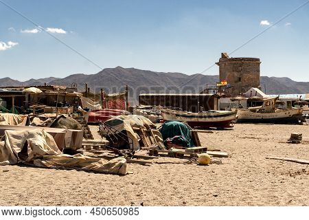 Cabo De Gata, Spain - September 04, 2020: Fishing Boats And Ships Stranded On The Beach Sand In The 