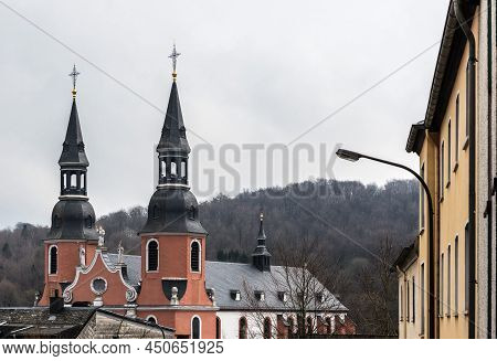 Prum, Rhineland-palatinate Germany -04 08 2019 View Over The Red Twin Towers Of The Abbey