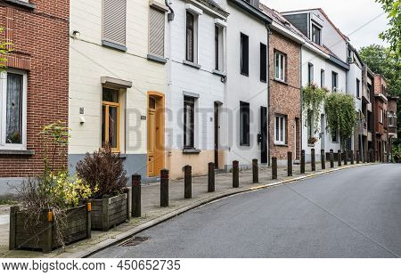 Uccle, Brussels - Belgium - 06 14 2019: A Curling Street With Typical Old Fashioned Houses