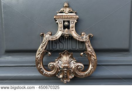 European Vintage Old Metal Wrought Iron Door Knocker. Design Detail. Paris.