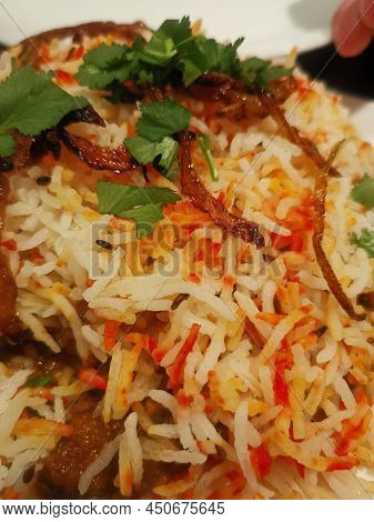 Colourful Vertical Image Of Indian Biriani Dish With Red And White Rice