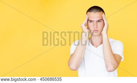 Headache Suffer. Sick Man. Problem Overload. Gloomy Considering Guy Holding Head With Hands On Templ