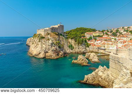 Aerial View On Dubrovnik City Walls Of Croatia. View Of Fort Lovrijenac Fortress, And The West Harbo