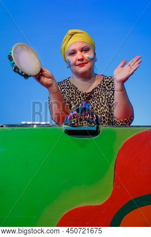 A Jewish Woman In A Headdress With A Painted Magen David Face Leads The Noise On Purim While Reading