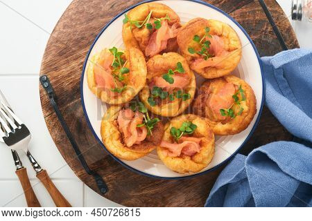 Yorkshire Pudding. Traditional English Yorkshire Pudding With Salmon And Radish Microgreens Side Dis