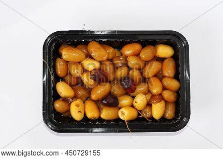 Arabic Fresh Yellow And Red Date Fruits In A Black Square Plate. White Background
