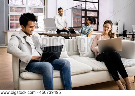 Young Diverse People Working In Coliving Space