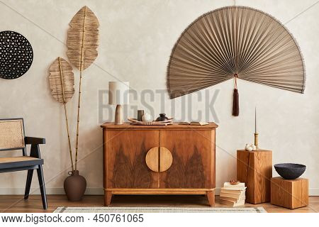 Japandi Concept Of Living Room Interior With Design Wooden Commode, Table Lamp, Tropical Dried Leaf