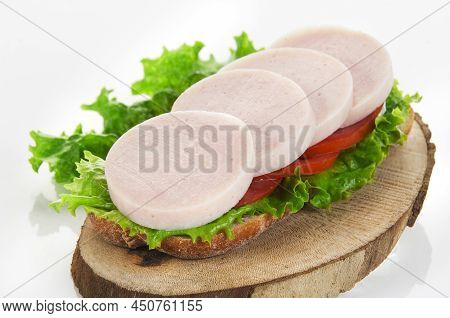 Slices Of Boiled Turkey Filet On A Wooden Board(horizontal)