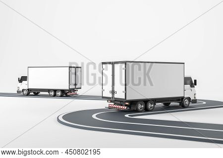 Two White Trucks Isolated Over White Background, Moving On Asphalt Road. Concept Of Shipment And Log