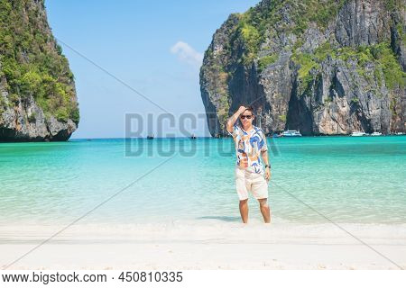 Happy Tourist Man At Maya Bay Beach On Phi Phi Island, Krabi, Thailand. Landmark, Destination Southe