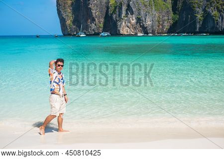 Happy Tourist Man At Maya Bay Beach On Phi Phi Island, Krabi, Thailand. Landmark, Destination Southe