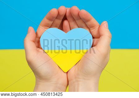 Yellow-blue Heart In The Color Of The Flag Of Ukraine In The Hands Of A Person, A Place For Text. Lo