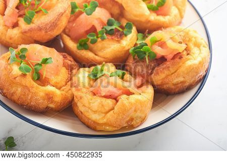 Yorkshire Pudding. Traditional English Yorkshire Pudding With Salmon And Radish Microgreens Side Dis