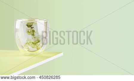 Glass Of Water With Liquid Chlorophyll On A Green Table. Light Green Gradient Background, Horizontal