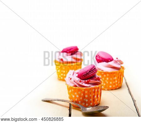 Pink Berry Cream Cupcake With Macaroon On Top
