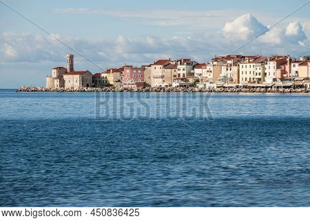 Panorama Of  Piran, Slovenia, With The Adriatic Sea In Front, With Blue Water And Sky, On A Wharf An
