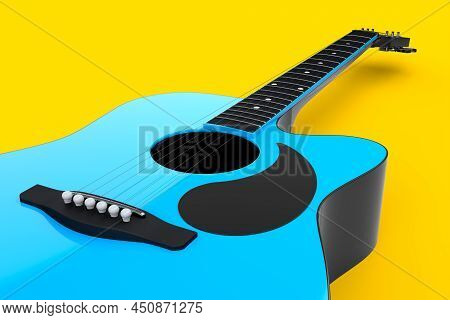 Close-up Of Acoustic Guitar Isolated On Yellow Background.