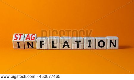 Stagflation Or Inflation Symbol. Turned Wooden Cubes And Changed The Concept Word Inflation To Stagf