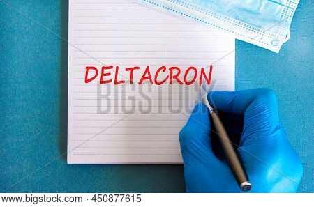 New Covid-19 Deltacron Variant Strain Symbol. Hand In Blue Glove With White Note. The Concept Word D