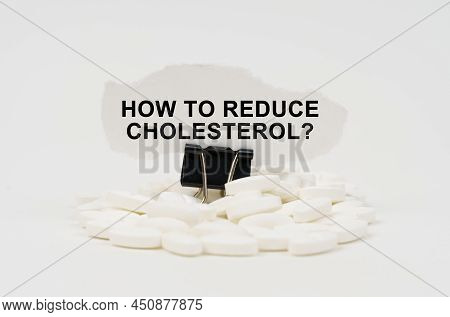 Medical Concept. On A White Surface Are Pills And Torn Paper With The Inscription - How To Reduce Ch