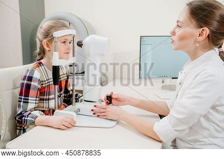 Ophthalmologist Examines The Girl On A Corneo Topographer. Modern Clinic.