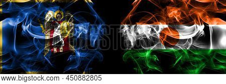 Kyiv, Kiev Vs Niger, Nigerien Flag. Smoke Flags Placed Side By Side Isolated On Black Background.